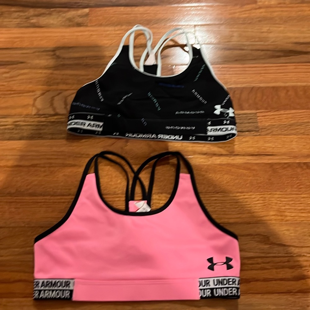 2 bras with no pads and crossover back and 4 stings up top